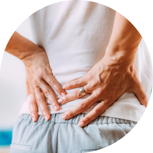 Woman holding her back due to pain